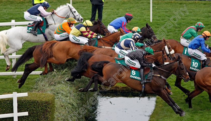 Balnaslow-0003 
 The field for The Randox Health Foxhunters Chase stream over the water jump with winner BALNASLOW (no1, Derek O'Connor) in front rank, also CURRAIGFLEMENS (5,Richard Collinson) and GALLERY EXHIBITION (Guy Disney, blue and beige) Aintree 12 Apr 2018 - Pic Steven Cargill / Racingfotos.com