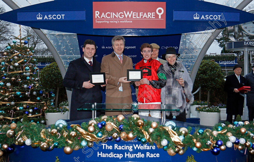 Hunters-Call-0014 
 Presentation by Richard Farquhar to Olly Murphy and Jack Kennedy for The Racing Welfare Handicap Hurdle won by HUNTERS CALL Ascot 23 Dec 2017 - Pic Steven Cargill / Racingfotos.com