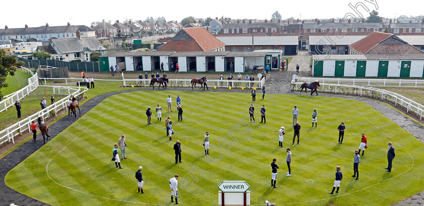 Pat-Smullen-silence-0001 
 Jockeys and staff observe a minute's silence in honour of Pat Smullen in the parade ring prior to the first race
Yarmouth 16 Sep 2020 - Pic Steven Cargill / Racingfotos.com