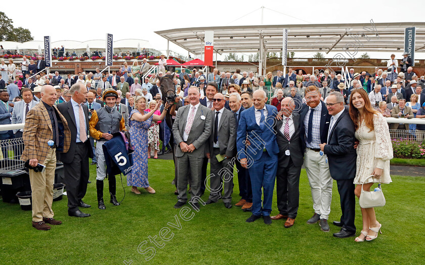 Indian-Run-0008 
 INDIAN RUN (Daniel Tudhope) with Eve Johnson-Houghton and owners, including Jonny Bairstow (3rd right) after The Tattersalls Acomb Stakes
York 23 Aug 2023 - Pic Steven Cargill / Racingfotos.com