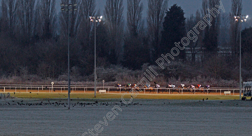 Uncle-Dick-0003 
 Horses race towards the far turn in The Play Ladbrokes 5-A-Side On Football Handicap won by UNCLE DICK (red)
Wolverhampton 7 Jan 2021 - Pic Steven Cargill / Racingfotos.com