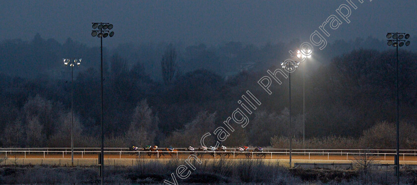 Uncle-Dick-0005 
 Horses race towards the far turn in The Play Ladbrokes 5-A-Side On Football Handicap won by UNCLE DICK (red)
Wolverhampton 7 Jan 2021 - Pic Steven Cargill / Racingfotos.com