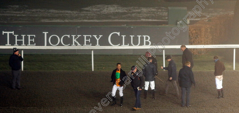 Kempton-0003 
 Jockeys, trainers and officials inspect the track prior racing's abandonment after the 2nd race
Kempton 16 Dec 2022 - pic Steven Cargill / Racingfotos.com