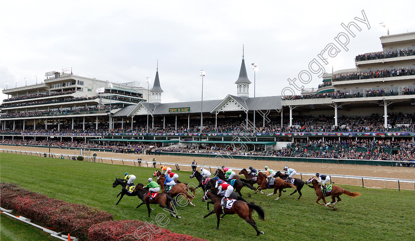 Line-Of-Duty-0007 
 LINE OF DUTY (No 5, blue, William Buick) with the field passing the stands shortly after the start of The Breeders' Cup Juvenile Turf
Churchill Downs 2 Nov 2018 - Pic Steven Cargill / Racingfotos.com