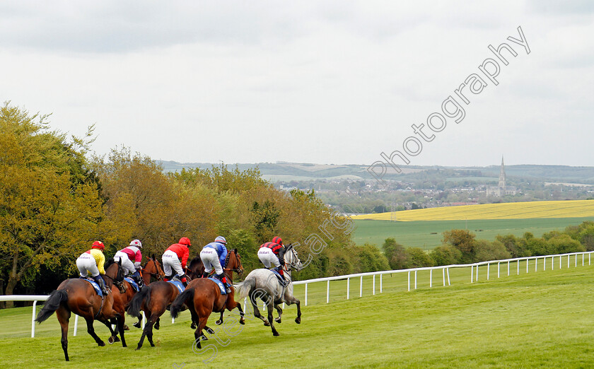 Pretty-Jewel-0006 
 PRETTY JEWEL (blue, Luke Catton) tracks the leaders on her way to winning The Peter Symonds Catering Fillies Handicap Salisbury 30 Apr 2018 - Pic Steven Cargill / Racingfotos.com