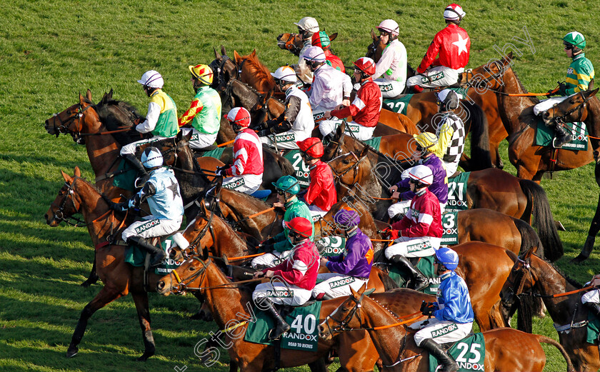 Aintree-0001 
 The field approaches the start for The Randox Health Grand National won by TIGER ROLL (Davy Russell, maroon cap white star) Aintree 14 Apr 2018 - Pic Steven Cargill / Racingfotos.com