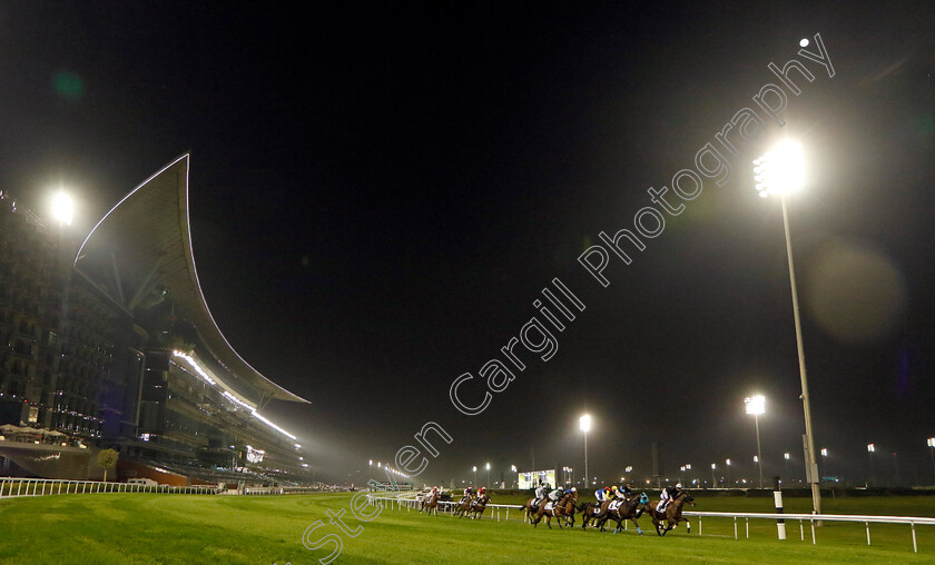 Meydan-0001 
 Runners pass the stands in The Vazirabad Handicap
Meydan, Dubai 3 Feb 2023 - Pic Steven Cargill / Racingfotos.com