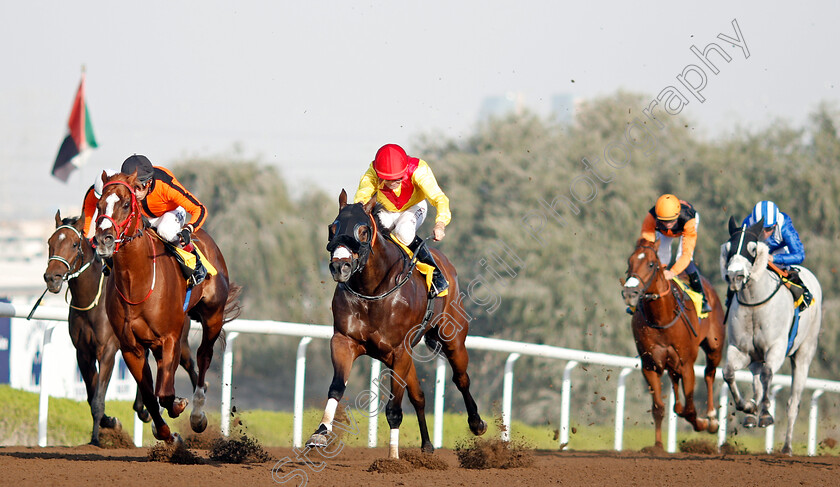 Lavaspin-0002 
 LAVASPIN (centre, Richard Mullen) beats ATTA ALLA (left) in The Roma Capannelle Maiden Jebel Ali 9 Mar 2018 - Pic Steven Cargill / Racingfotos.com