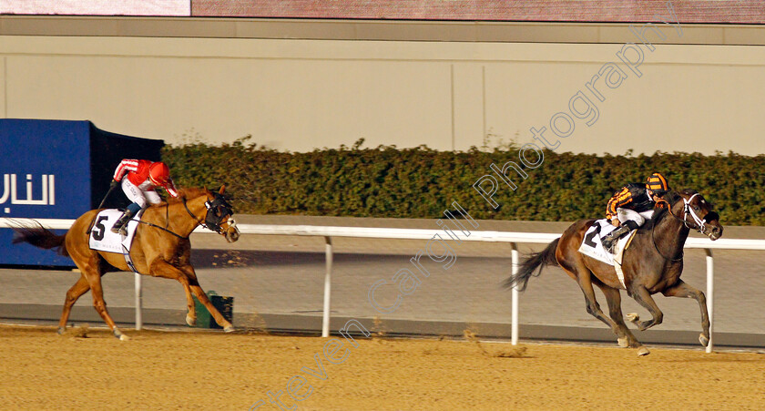 Kimbear-0001 
 KIMBEAR (Pat Dobbs) beats RODAINI (left) in The CEPSA Energy Cup Handicap Meydan 18 Jan 2018 - Pic Steven Cargill / Racingfotos.com