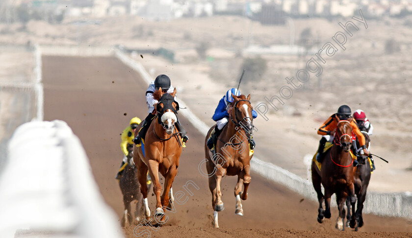 Interconnection-0001 
 INTERCONNECTION (left, Xavier Ziani) beats MUDAARAB (centre) in The Shadwell Farm Handicap Jebel Ali 9 Mar 2018 - Pic Steven Cargill / Racingfotos.com