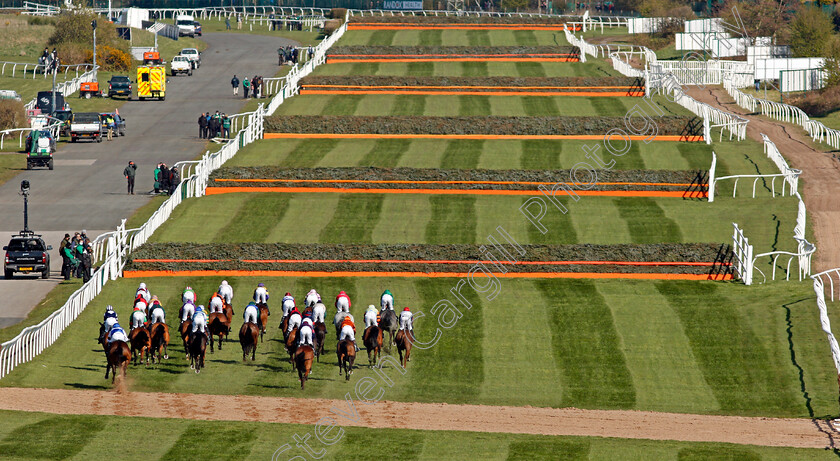 Livelovelaugh-0004 
 The field approaches the 4th fence in the Randox Topham Handicap Chase won by LIVELOVELAUGH
Aintree 9 Apr 2021 - Pic Steven Cargill / Racingfotos.com