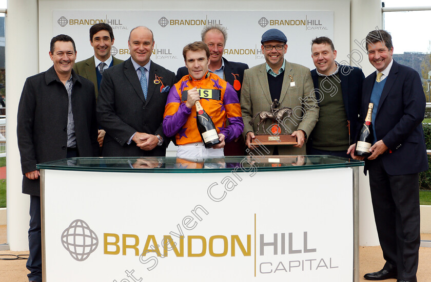 First-Assignment-0007 
 Presentation to Ian Williams, Tom Scudamore and owners for The Brandon Hill Capital Handicap Hurdle won by FIRST ASSIGNMENT
Cheltenham 26 Oct 2018 - Pic Steven Cargill / Racingfotos.com