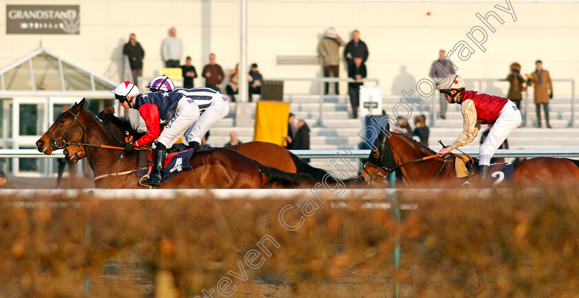 Perfect-Illusion-0003 
 PERFECT ILLUSION (right, Rob Hornby) tracks NO EQUALISERS (left) in the early stages of The 32Red Casino Novice Stakes Lingfield 23 Feb 2018 - Pic Steven Cargill / Racingfotos.com