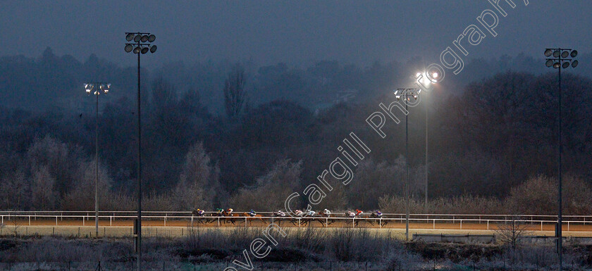 Uncle-Dick-0007 
 Horses race towards the far turn in The Play Ladbrokes 5-A-Side On Football Handicap won by UNCLE DICK (red)
Wolverhampton 7 Jan 2021 - Pic Steven Cargill / Racingfotos.com