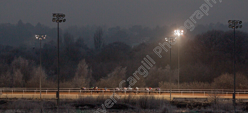 Uncle-Dick-0006 
 Horses race towards the far turn in The Play Ladbrokes 5-A-Side On Football Handicap won by UNCLE DICK (red)
Wolverhampton 7 Jan 2021 - Pic Steven Cargill / Racingfotos.com