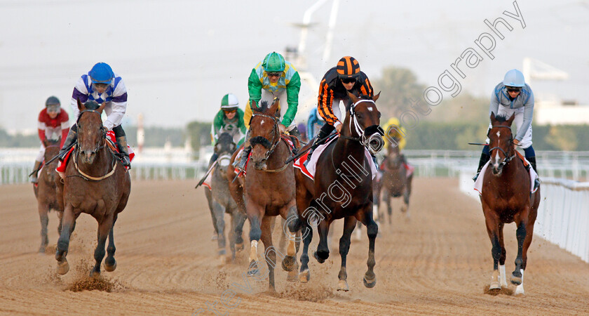 Kimbear-0005 
 KIMBEAR (centre, Pat Dobbs) beats SECRET AMBITION (2nd left) MUSAWAAT (left) and HEAVY METAL (right) in The Burj Nahaar Meydan Dubai 10 Mar 2018 - Pic Steven Cargill / Racingfotos.com