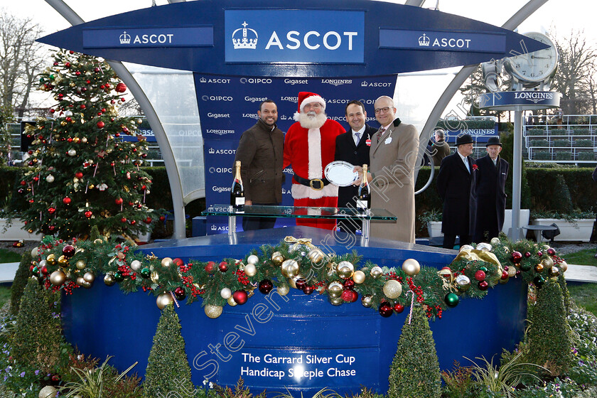 Valtor-0008 
 Presentation by Rishi Persad and Father Christmas to Simon Munir for The Garrard Silver Cup Handicap Chase won by VALTOR 
Ascot 22 Dec 2018 - Pic Steven Cargill / Racingfotos.com