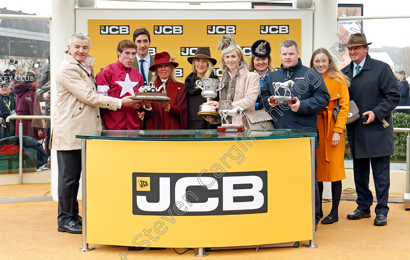 Farclas-0007 
 Presentation by Lady Bamford (red) to Michael O'Leary and family, Gordon Elliott and Jack Kennedy for The JCB Triumph Hurdle won by FARCLAS Cheltenham 16 Mar 2018 - Pic Steven Cargill / Racingfotos.com