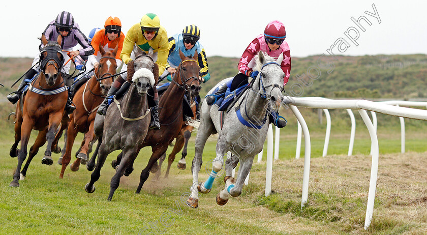 Honcho-0003 
 HONCHO (Victoria Malzard) leads the field around the home turn with winner AFRICAN SHOWGIRL (orange, Tim Clark) still in rear
Les Landes Jersey 26 Aug 2019 - Pic Steven Cargill / Racingfotos.com