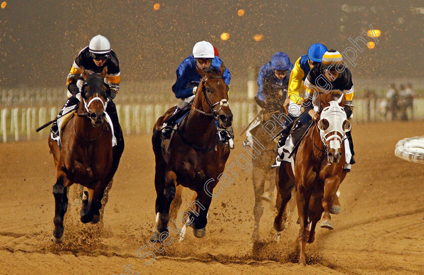 Don t-Give-Up-0002 
 DON'T GIVE UP (centre, Gerald Mosse) at the first turn with GRAND ARGENTIER (left) and ACTIVE SPIRIT (right) on his way to winning The EGA Potlines Trophy Handicap Meydan 25 Jan 2018 - Pic Steven Cargill / Racingfotos.com