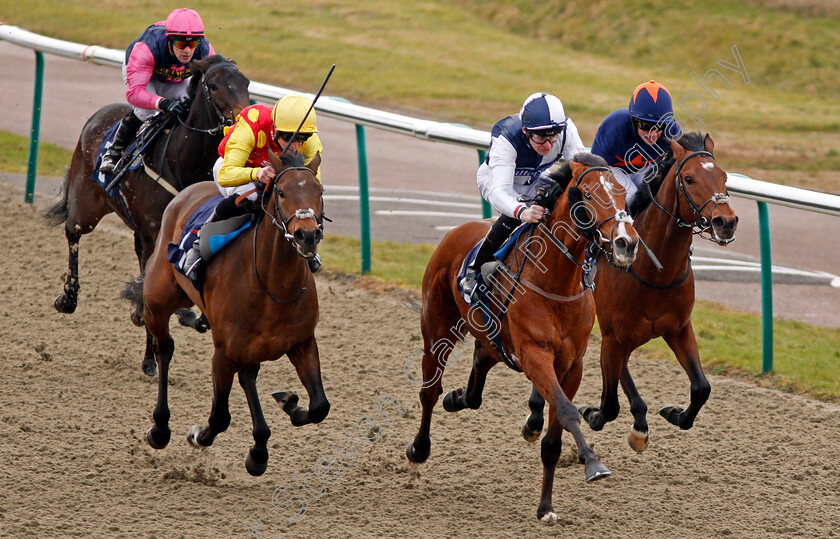 Hasanoanda-0007 
 HASANOANDA (centre, Robert Havlin) beats AMBIENT (left) and CRAVING (right) in The 32Red.com Novice Median Auction Stakes Lingfield 6 Jan 2018 - Pic Steven Cargill / Racingfotos.com