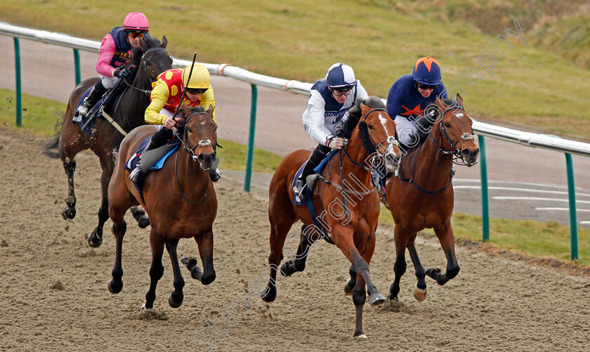 Hasanoanda-0005 
 HASANOANDA (centre, Robert Havlin) beats AMBIENT (left) and CRAVING (right) in The 32Red.com Novice Median Auction Stakes Lingfield 6 Jan 2018 - Pic Steven Cargill / Racingfotos.com