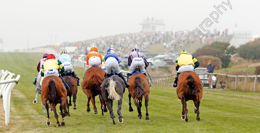 Les-Landes-0014 
 The field turn into the home straight at Les Landes in the final race won by AFRICAN SHOWGIRL (orange)
Les Landes, Jersey 26 Aug 2019 - Pic Steven Cargill / Racingfotos.com