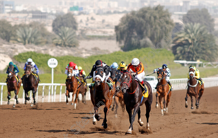 Epsilon-0001 
 EPSILON (centre, Liam Tarentaal) beats CALL SIGN (right) in The School Transport Services Handicap Jebel Ali 9 Mar 2018 - Pic Steven Cargill / Racingfotos.com