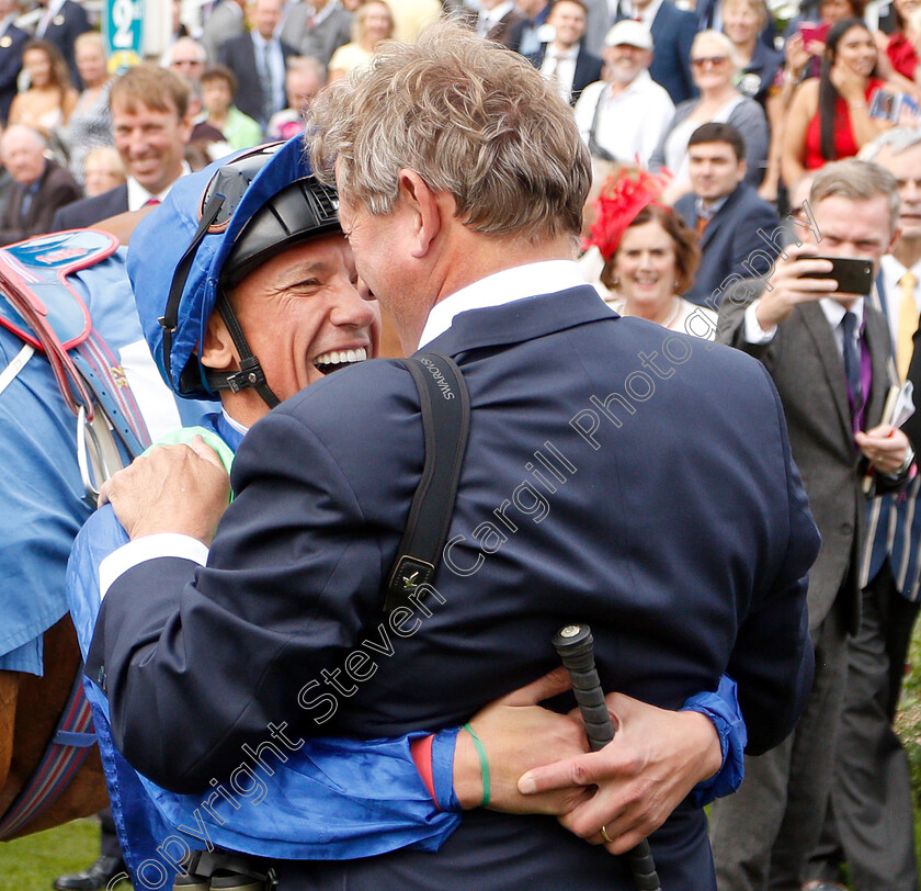 Mark-Johnston-Frankie-Dettori 
 MARK JOHNSTON recieves a hug from Frankie Dettori after becoming the winningmost trainer in UK with the win of POET'S SOCIETY in The Clipper Logistics Handicap
York 23 Aug 2018 - Pic Steven Cargill / Racingfotos.com