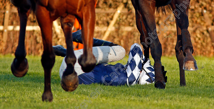 Kevin-Dowling-0001 
 KEVIN DOWLING amongst hooves after being unseated from FIDUX as MARIA'S BENEFIT (Ciaran Gethings) wins The Play Casino At 188bet Handicap Hurdle Sandown 12 Nov 2017 - Pic Steven Cargill / Racingfotos.com