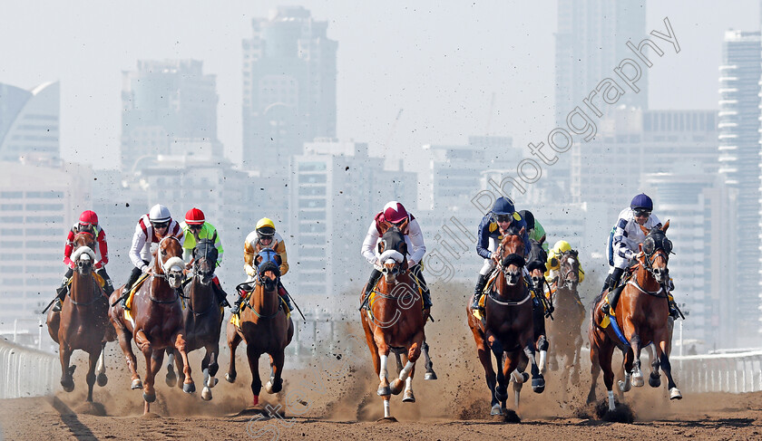 Jebel-Ali-0007 
 Horses race down the back straight at Jebel Ali in the first race won by HAWKER (left) Dubai 9 Feb 2018 - Pic Steven Cargill / Racingfotos.com