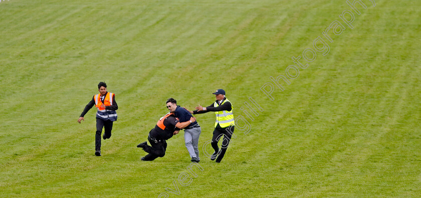 AR-0001 
 Animal rising protestor tackled by security on track 
Epsom 3 Jun 2023 - Pic Steven Cargill / Racingfotos.com