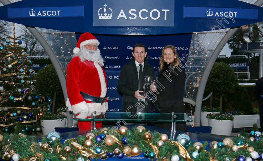 Didtheyleaveuoutto-0010 
 Presentation by Father Christmas and Juliet Slot to A P McCoy for The St Andrews Holdings Championship Standard Open National Hunt Flat Race won by DIDTHEYLEAVEUOUTTO Ascot 22 Dec 2017 - Pic Steven Cargill / Racingfotos.com